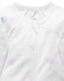 Close up of pink tree pattern on sleep suit