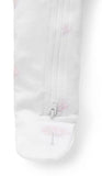 Close up of pink tree pattern on sleep suit with zip