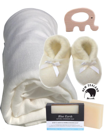 Baby gift box with New Zealand merino blanket, wool booties, natural soap and a wooden teether.